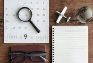 Open diary and calendar with passport